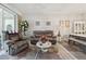 Inviting living room featuring a ceiling fan, neutral decor, and a view of the dining area at 767 Tremont Greens Ln # 64, Sun City Center, FL 33573