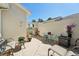 Secluded patio featuring brick pavers, decorative plants, and cozy outdoor seating area at 767 Tremont Greens Ln # 64, Sun City Center, FL 33573