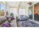 Sunroom featuring a comfortable seating area with large windows and bright light at 767 Tremont Greens Ln # 64, Sun City Center, FL 33573