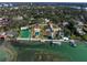 Sprawling waterfront property features multiple pools, tennis courts, and manicured grounds for ultimate outdoor enjoyment at 800 Druid S Rd, Clearwater, FL 33756