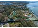 Expansive waterfront estate featuring lush greenery, tennis courts, pools, and private docks, offering luxurious outdoor living at 800 Druid S Rd, Clearwater, FL 33756