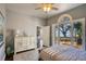 Bright bedroom with outdoor access featuring water views at 800 Druid S Rd, Clearwater, FL 33756