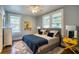 Well-lit bedroom featuring a queen bed, stylish decor, and large windows at 800 Druid S Rd, Clearwater, FL 33756