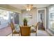 Cozy dining area featuring a ceiling fan and sliding door access to the patio at 800 Druid S Rd, Clearwater, FL 33756