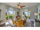 Bright dining room with a glass table and chairs, offering beautiful views of the waterfront at 800 Druid S Rd, Clearwater, FL 33756