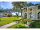 Beautifully landscaped front yard with a brick path leading to the stunning home at 800 Druid S Rd, Clearwater, FL 33756