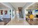 Spacious foyer with tile flooring, a staircase, and an open layout leading to the kitchen and living areas at 800 Druid S Rd, Clearwater, FL 33756