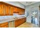Well-lit kitchen with granite countertops and abundant wood cabinetry at 800 Druid S Rd, Clearwater, FL 33756