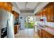 Updated kitchen featuring stainless steel appliances and granite countertops, with outdoor access at 800 Druid S Rd, Clearwater, FL 33756