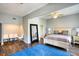 Comfortable main bedroom with ceiling fan, wooden floors, area rug, and contemporary furnishings at 800 Druid S Rd, Clearwater, FL 33756