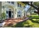 Outdoor patio with seating, perfect for entertaining, with views of the well-manicured lawn at 800 Druid S Rd, Clearwater, FL 33756