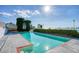 Relaxing pool area with lush greenery, bay views, and plenty of space for lounging at 800 Druid S Rd, Clearwater, FL 33756