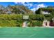 Private sport court featuring a basketball hoop surrounded by lush greenery and elegant architectural design at 800 Druid S Rd, Clearwater, FL 33756