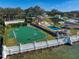 Waterfront estate featuring a basketball court, gazebo, pool, and tennis court offers diverse recreational opportunities at 800 Druid S Rd, Clearwater, FL 33756