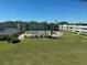 Aerial view showcases the community's well-manicured lawn, sparkling pool area, and multiple residential buildings at 8100 Dr Martin Luther King Jr N St # 302, St Petersburg, FL 33702
