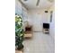 Bright sunroom featuring tiled flooring, a desk, a plant and large windows with blinds at 8100 Dr Martin Luther King Jr N St # 302, St Petersburg, FL 33702