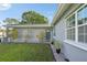 Close up of the front door of a single-story home with a well manicured lawn and garden at 8128 Candlwoode Dr, Largo, FL 33773