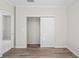 Bedroom with sliding door closet and neutral paint at 8725 N Boulevard, Tampa, FL 33604
