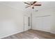 Bright bedroom featuring a ceiling fan, closet and wood-look flooring at 8725 N Boulevard, Tampa, FL 33604