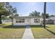 Charming home with well-maintained lawn and walkway at 8725 N Boulevard, Tampa, FL 33604