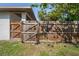 Wood fence with gate providing privacy to the yard at 8725 N Boulevard, Tampa, FL 33604