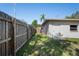 Fenced side yard leading to a back entrance of the home at 8725 N Boulevard, Tampa, FL 33604