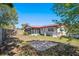 A beautiful and enclosed backyard with a slab and a screened-in porch at 9222 Century Dr, Spring Hill, FL 34606