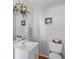 Charming powder room with classic fixtures and neutral tones at 9222 Century Dr, Spring Hill, FL 34606