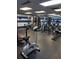 Well-equipped fitness center with an array of modern exercise machines and mirrored wall at 10034 64Th N Ave # 11, St Petersburg, FL 33708