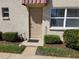 Charming front entryway with decorative landscaping around a well maintained home at 10034 64Th N Ave # 11, St Petersburg, FL 33708