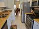 Well-lit kitchen with stainless steel appliances and granite countertops at 10034 64Th N Ave # 11, St Petersburg, FL 33708