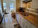 Bright kitchen with stainless steel appliances and granite countertops with easy access to the living room at 10034 64Th N Ave # 11, St Petersburg, FL 33708