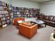 Inviting library space with floor to ceiling bookshelves, comfortable seating, and ample reading space at 10034 64Th N Ave # 11, St Petersburg, FL 33708