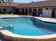 Community pool featuring crystal blue water, deck and inviting scenery at 10034 64Th N Ave # 11, St Petersburg, FL 33708