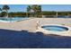 Beautiful pool and hot tub with lovely brick paver patio and lots of seating at 10034 64Th N Ave # 11, St Petersburg, FL 33708