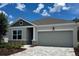 Charming single-story home featuring a two-car garage and a beautifully landscaped front yard at 10636 Crescent Creek Xing, Parrish, FL 34219