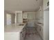 White kitchen features granite countertops, modern cabinets, and stainless steel appliances at 10636 Crescent Creek Xing, Parrish, FL 34219