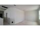 Upstairs bonus room with neutral walls and three doors ready for finishing at 10644 Crescent Creek Xing, Parrish, FL 34219