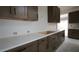 Modern kitchen featuring sleek white countertops and contemporary wood cabinets at 10644 Crescent Creek Xing, Parrish, FL 34219