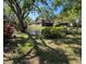 Scenic pond view showcasing lush landscaping and the exterior of the townhome community at 11609 Parkview Ln # 53, Seminole, FL 33772