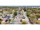 An elevated view reveals a residential street with mature trees and a variety of single-Gathering homes at 12636 95Th N St, Largo, FL 33773