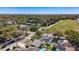 An aerial view highlights the home's location within a lush, green neighborhood with mature trees at 12636 95Th N St, Largo, FL 33773