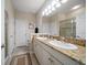 Bathroom featuring double sinks, granite countertops, and a glass-enclosed shower at 13208 San Blas Loop, Largo, FL 33774