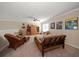 Spacious bonus room with a ceiling fan, neutral walls, and comfortable seating at 13208 San Blas Loop, Largo, FL 33774