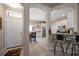 Inviting home entryway leading to a kitchen with modern finishes and stainless steel appliances at 13208 San Blas Loop, Largo, FL 33774