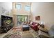 Spacious living room with large windows and sliding glass door, which brings in natural light at 13208 San Blas Loop, Largo, FL 33774