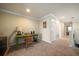 Office area with a green desk, neutral-toned walls, and a view of the hallway at 13208 San Blas Loop, Largo, FL 33774