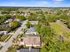 Aerial view of the homes and community surrounded by mature trees at 13526 Norman Cir, Hudson, FL 34669
