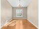 Dining room featuring a chandelier and sunlit window with plantation shutters at 13526 Norman Cir, Hudson, FL 34669