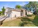 Charming single-story home featuring a well-manicured lawn and attached two car garage at 13526 Norman Cir, Hudson, FL 34669